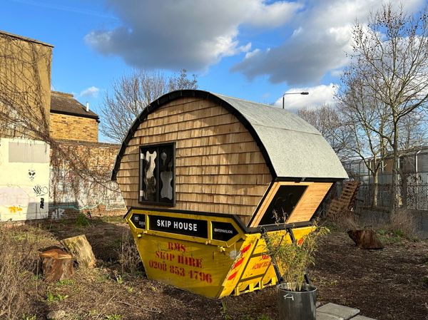 Artist’s house in a skip could face council enforcement action